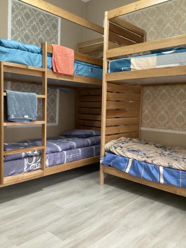 a bunk bed room with two bunk beds at Buddha Hostel in Chişinău