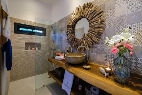 a bathroom with a sink and a mirror at Villa Manglar in Las Terrenas