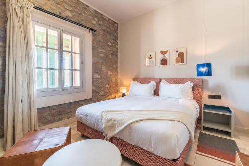 a bedroom with a large bed and a window at JEMAA EL FNA Suites & Spa in Marrakesh