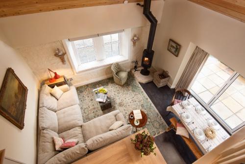 an overhead view of a living room with a couch at The Bothy at Redheugh in Newcastleton