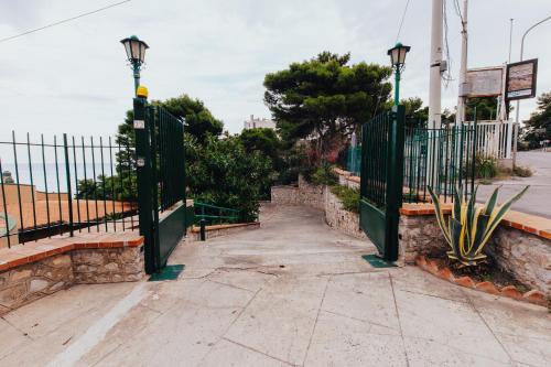 an entrance to a gate with a fence at Monia beach house in Santa Flavia