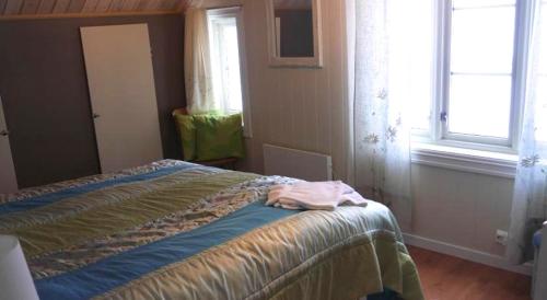 Postel nebo postele na pokoji v ubytování Jordbærstova Feriehus