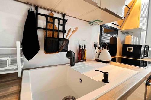 a kitchen with a sink and a counter top at 1-Bed Apartment Sleeps 2 -Free Parking -WiFi & Tv in Dundee