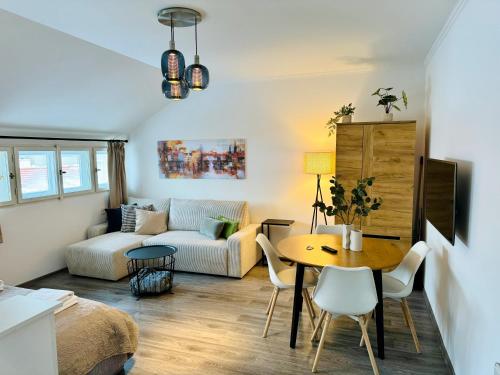 a living room with a table and a couch at Beautiful Apartment Dlouhá in Prague