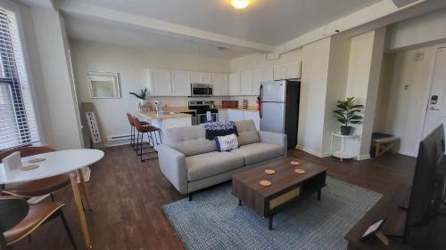 a living room with a couch and a table at Amazing 1 BR Apt In City Center in Detroit
