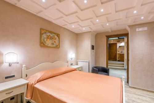 Ένα ή περισσότερα κρεβάτια σε δωμάτιο στο B&B La Casa Nel Giardino