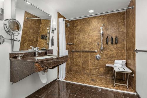 a bathroom with a shower and a sink at The Verve Boston Natick, Tapestry Collection by Hilton in Natick