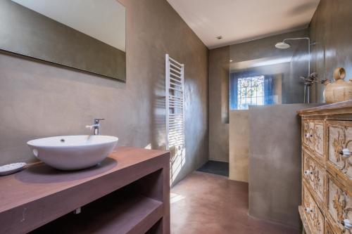 a bathroom with a white bowl sink on a counter at CC-1 Casa de Campo 8Pax in Begur