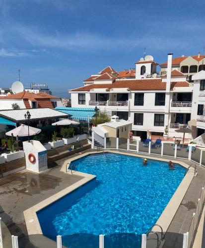 a large swimming pool in front of a building at El Diamantino 202 WiFi Pool in Los Cristianos