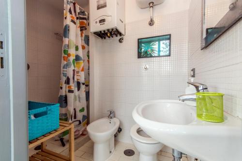 a bathroom with a sink and a toilet at Historical Naples with panoramic terrace in Naples