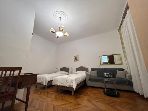 a living room with two beds and a couch at Apartment Croatia in Zagreb