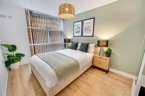 a bedroom with a large bed and a window at Host & Stay - The Skandi Hideaway in Liverpool