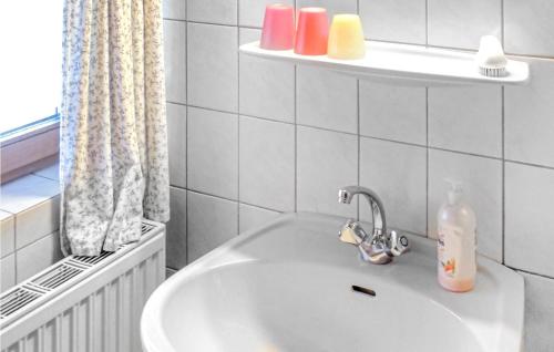 a bathroom sink with a soap bottle on it at Beautiful Home In Radstadt With 2 Bedrooms in Radstadt