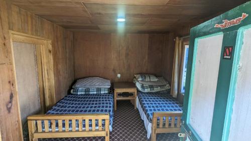 Een bed of bedden in een kamer bij Garikhasa homestay