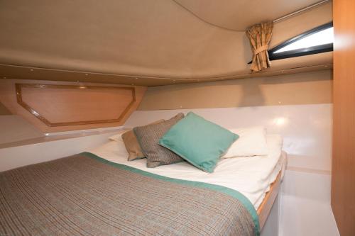 a bed in the back of a boat at Caley Cruisers in Inverness