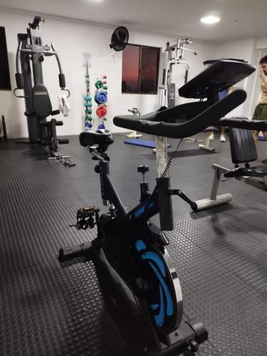 a gym with a bike and several tread machines at Ocean Atlantic Praia de Iracema in Fortaleza
