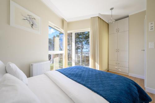 Postel nebo postele na pokoji v ubytování Navango Apartment Sea View & Free Parking