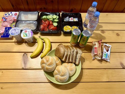 a table with a plate of breakfast foods and drinks at Rezidence Alpina in Špindlerův Mlýn