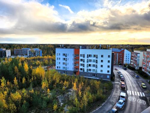 an aerial view of a city with a building at Tasokas 2 h + k + s Söderkullassa - huikeat näköalat in Sipoo