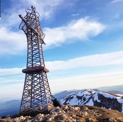 a metal tower on top of a mountain at Nice and cosy flat near Geneva or Annecy in Bellegarde-sur-Valserine