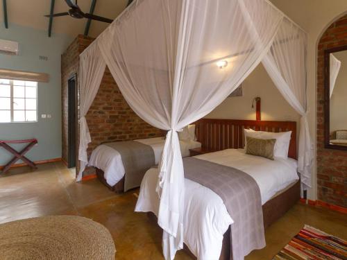 Voodi või voodid majutusasutuse The Courtney Lodge toas