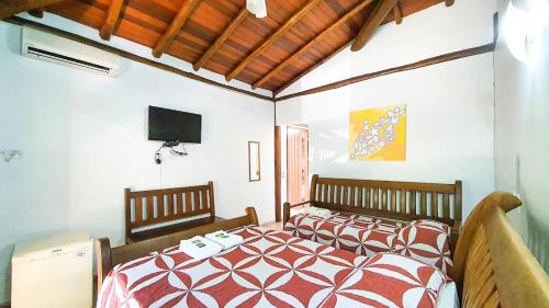 Ένα ή περισσότερα κρεβάτια σε δωμάτιο στο Hotel e Pousada Canto Mágico