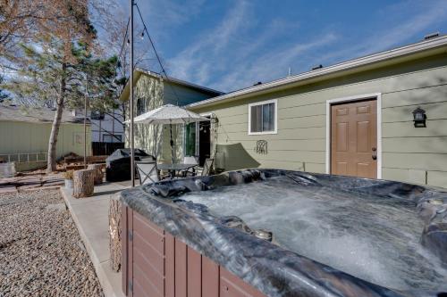 a hot tub in the backyard of a house at Loveland Home with Private Hot Tub and Wood Fireplace! in Loveland