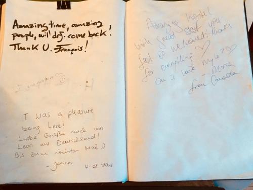 a diary with handwriting on the pages at White Rabbit Hostel in Siem Reap