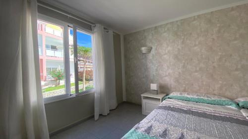 a bedroom with a bed and a large window at Apt. El Guirre Nº 14 in Valle Gran Rey