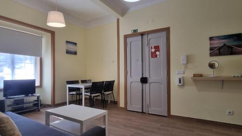 a living room with a couch and a table at Lightoasis Oeiras 5 in Oeiras