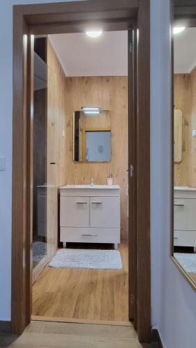 a bathroom with a sink and a mirror at Lightoasis Oeiras 5 in Oeiras