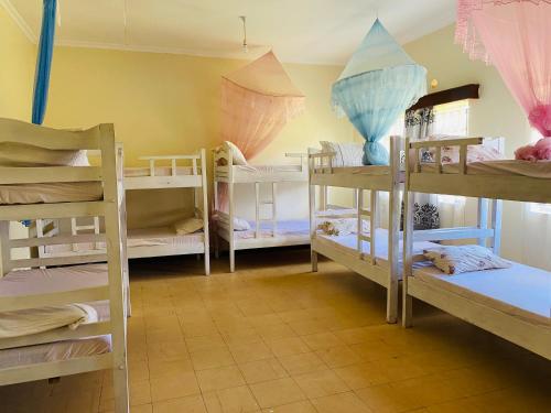 a room with a bunch of bunk beds at Lisa place milimani in Kitale