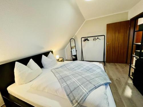Postel nebo postele na pokoji v ubytování NEU! FeWo Flussland nähe SPO