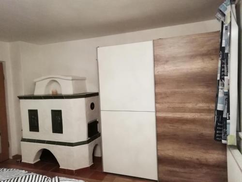 a kitchen with a stove and a refrigerator in a room at Ferienwohnung Thresi Leo in Hart im Zillertal