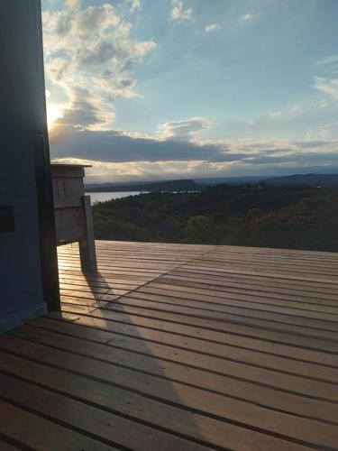 a bench sitting on top of a wooden deck at Modulo - Gorska Voda in Embalse