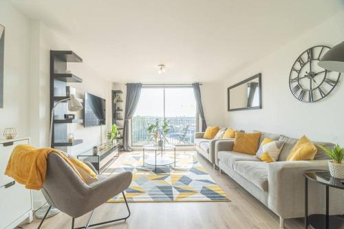 a living room with a couch and a table at Luxury Riverview City Centre Apartment 2 in Glasgow