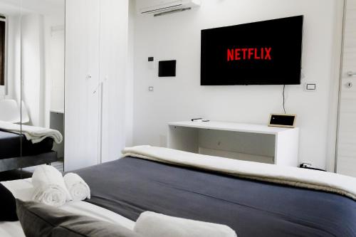 Cama o camas de una habitación en SASSARI-CENTRO Elegante Appartamento con WiFi e Netflix