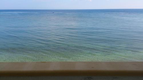 a view of the ocean from the beach at Allu Ruvezzu in Torre Mozza