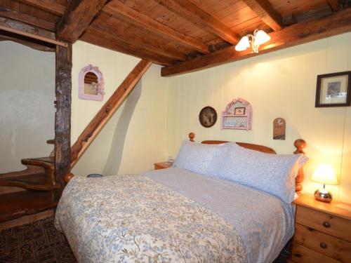 a bedroom with a bed and a wooden ceiling at 4 Bed in Corfe Mullen THOLD in Corfe Mullen