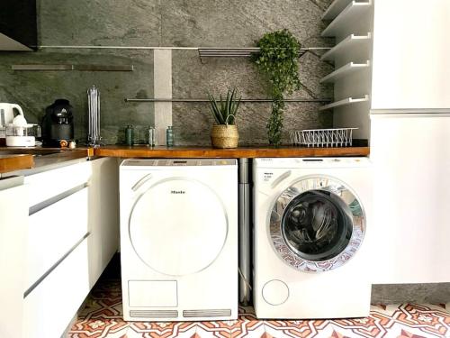 a white washer and dryer in a kitchen at Amy 2 in Tarascon