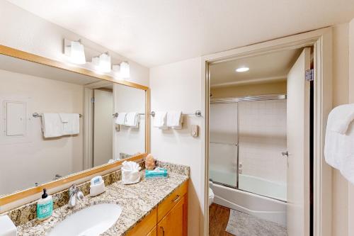 a bathroom with a sink and a mirror at Rockies Condo 2407 in Steamboat Springs