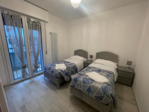 Postel nebo postele na pokoji v ubytování Residenza Lido adriano baia tartaruga