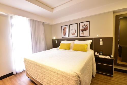 Katil atau katil-katil dalam bilik di Golden Tulip Goiania Address