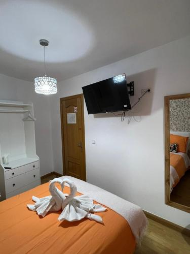 Ένα ή περισσότερα κρεβάτια σε δωμάτιο στο Hostal Flat55Madrid