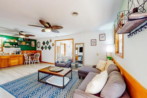 a living room with a couch and a table at The Cove - Main House in Golden