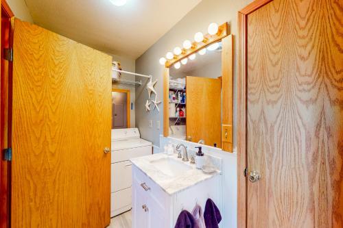 a bathroom with a sink and a mirror at The Cove - Main House in Golden