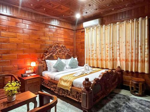 En eller flere senge i et værelse på HONG PEP HOTEL
