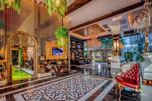 a room with a lobby with chandeliers at luxury stay Monaco in Na Jomtien