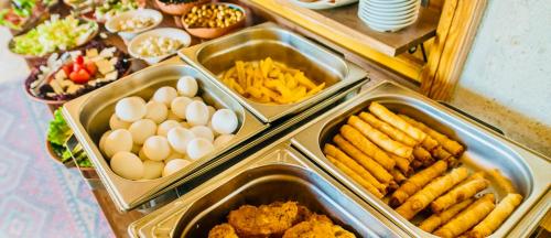 a buffet of food with eggs and french fries at Hotel Gritti Pera & Spa in Istanbul