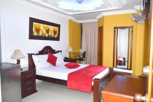 Кровать или кровати в номере Hotel Vans Valledupar